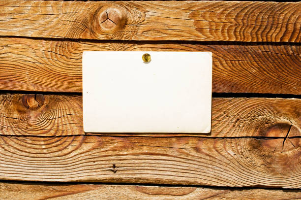 istock Wood wall with blank paper for message 652667016