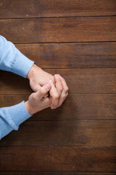 istock Praying hands of man 652670472