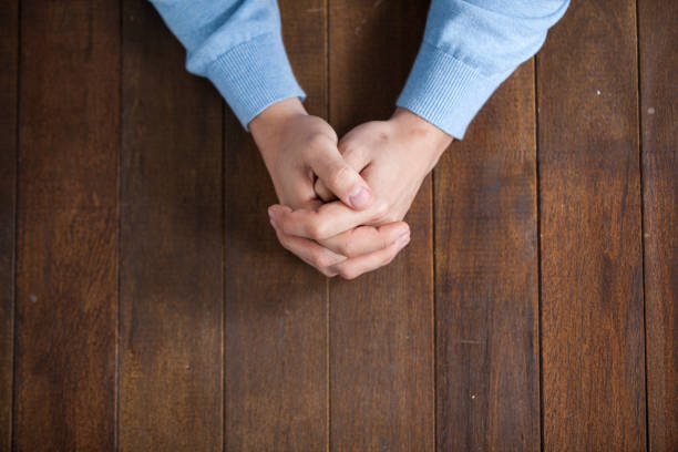 istock Praying hands of man 652670494