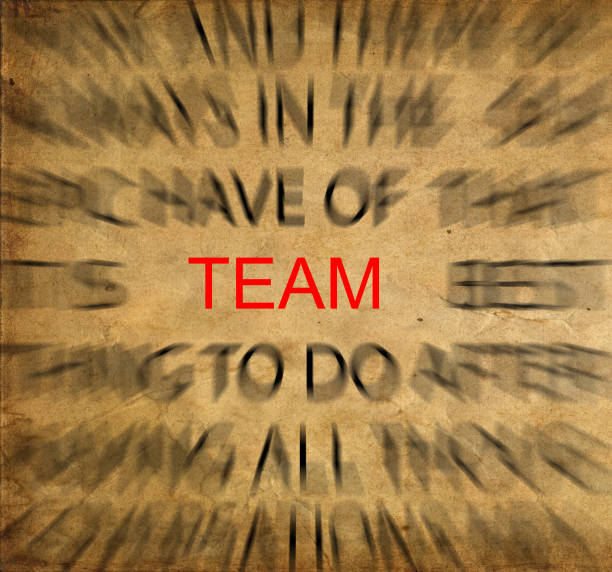 istock Blured text on vintage paper with focus on TEAM 652676148