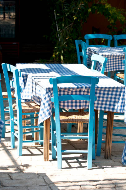 istock Greek restaurant with traditional blue table and chairs 652676316
