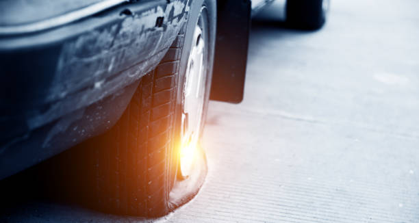 istock Close up of a flat tire on an old car 652698066