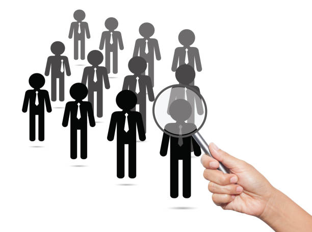 istock Hiring staff concept. Hand with magnifying glass finding and recruiting new worker. 652707742