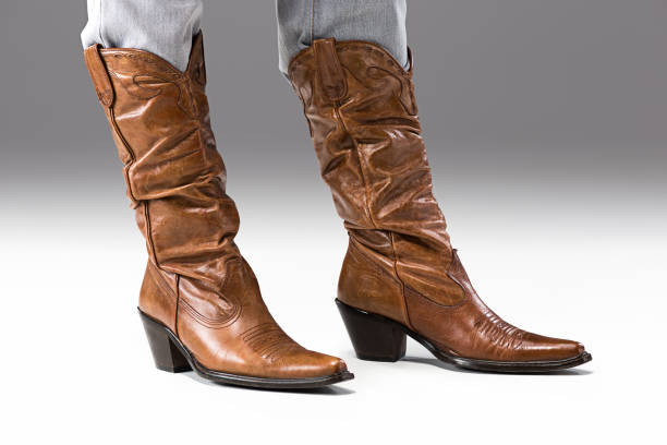 istock Legs in Jeans and Cowboys Boots 652708286