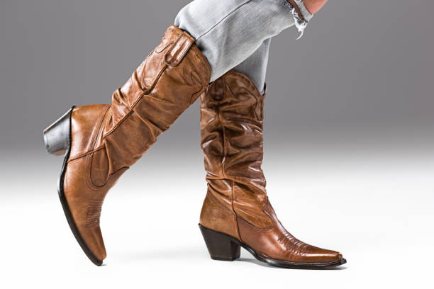istock Legs in Jeans and Cowboys Boots 652708320