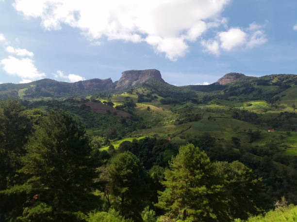 Landscape of the mountains of the Serra da Mantiqueira with the rock formations of Pedra do Baú in the background located in southeastern Brazil