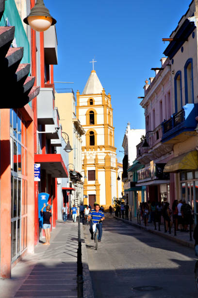 Camaguey, Cuba, December 19, 2016: The Soledad church in Camaguey. Some People walk on the street in front of the church
