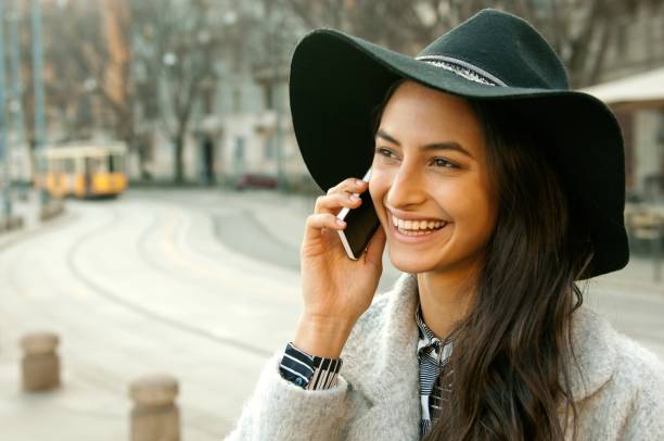 istock Smiling woman on the phone 652718254