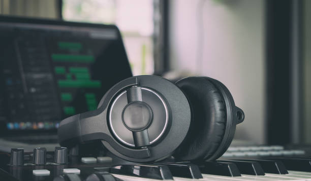 istock Headphone on a music keyboard in home mmsuic studio 652719340