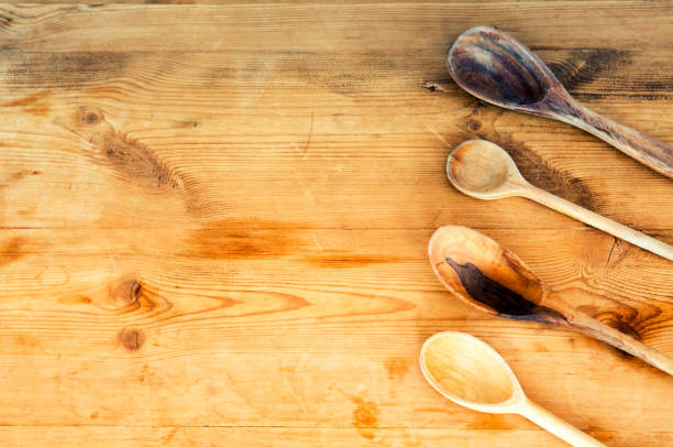 istock cooking spoons lined up on wooden table 652722342