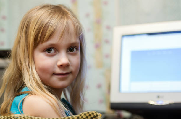 istock Little girl at the computer 652734552