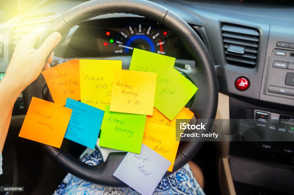 To do list in a car To do list in a car - busy day concept Adhesive Note Stock Photo