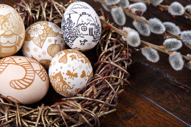 istock Decorative Easter eggs in a nest on a wooden table 652754748