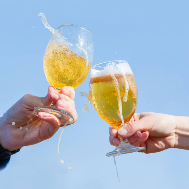istock Clinking Beer glasses against the sky. 652755202