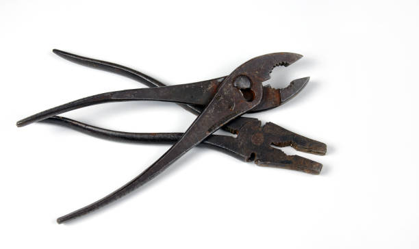 istock Crossed vintage pliers on a white background 652757622