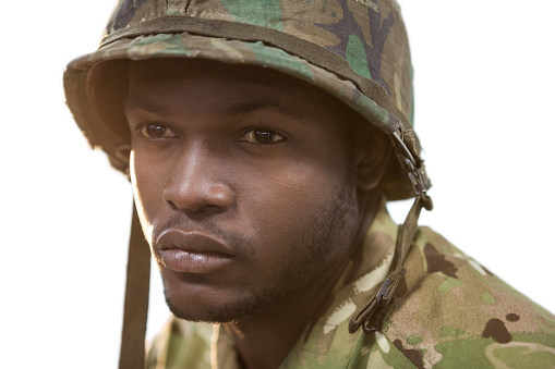 Close-up of thoughtful soldier against white background