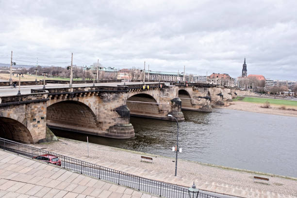 Dresden, Germany- January 4,2017:The bridge of Augustus, built in the XIII century and restored by the order of Augustus the Strong. Pedestrians and vehicles are moving along the bridge