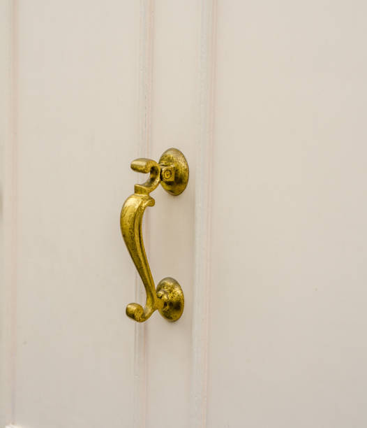 istock original brass knocker in the shape old decoration, wooden doors white 652779756