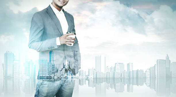 istock Man with coffee and a city 652784498