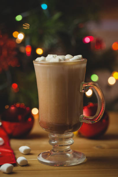 istock Cup of coffee with marshmallow on wooden table 652785618