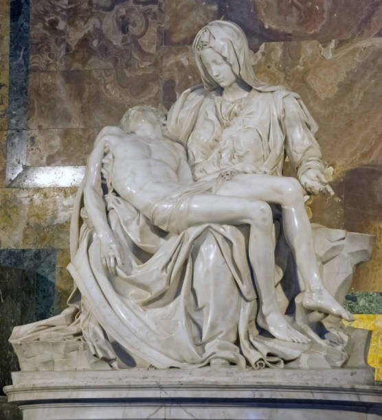ROME, ITALY - JULY 13, 2013. Visiting the the Basillica San Pietro. Pieta by Michelangelo. ROME, ITALY - JULY 13, 2013. Visiting the the Basillica San Pietro. Pieta by Michelangelo. pieta stock pictures, royalty-free photos & images