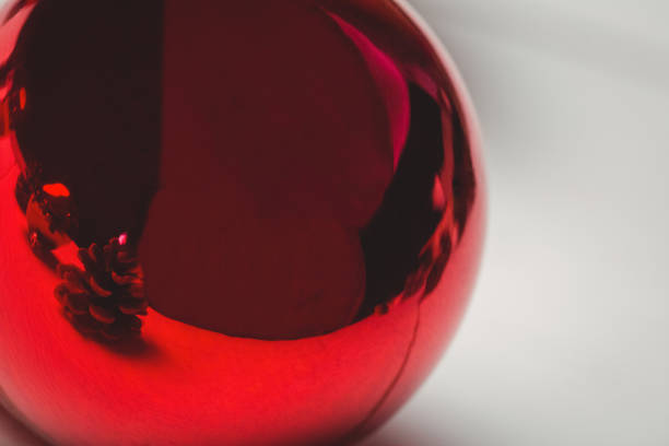 istock Red christmas bauble on wooden table 652792436