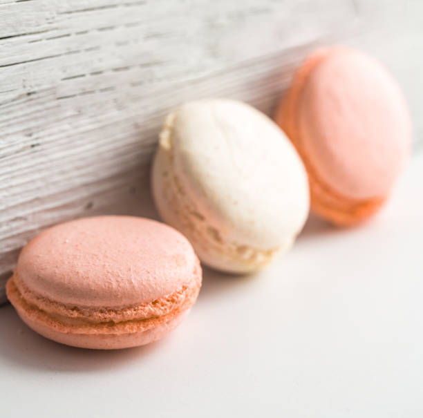 istock Colorful macaroons on wooden background 652793108