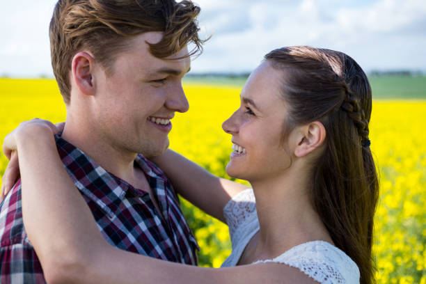 istock Romantic couple embracing each other in mustard field 652799590