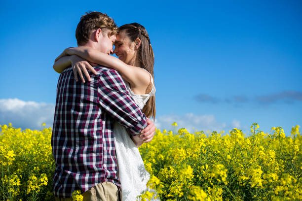 istock Romantic couple embracing each other in mustard field 652799670