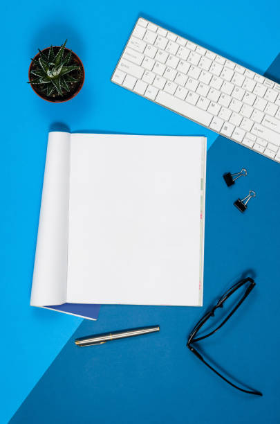 istock Mock-up blank page or magazine on colorful background top view 652799920