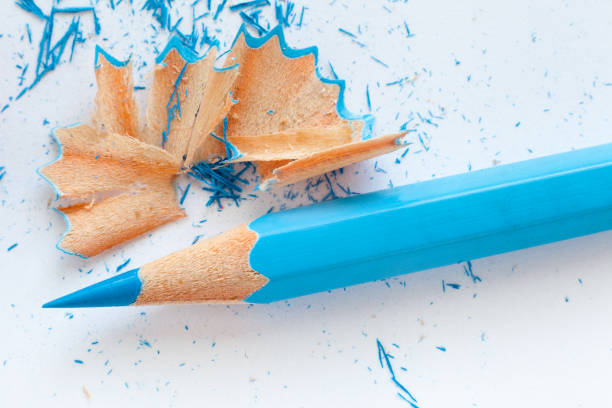 blue wooden pencil and pencil shavings stock photo