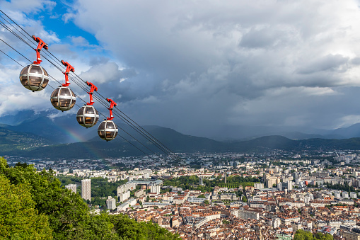 Picturesque aerial view of Grenoble city, France. Grenoble-Bastille cable car on the foreground (French: Telepherique de Grenoble Bastille)