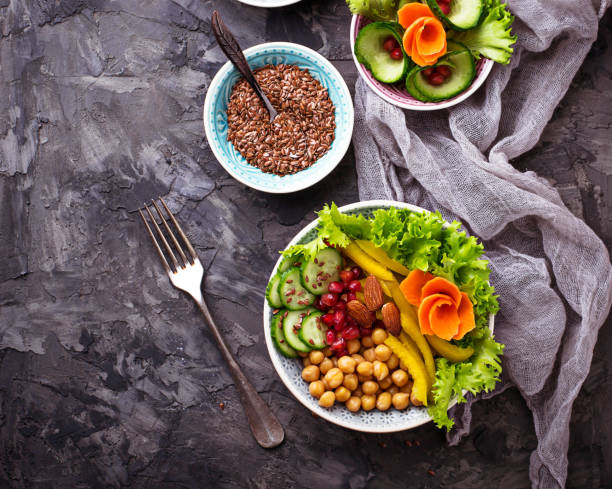 istock Vegetable salad with carrot, cucumber, pepper, almond and chick-pea 652806094