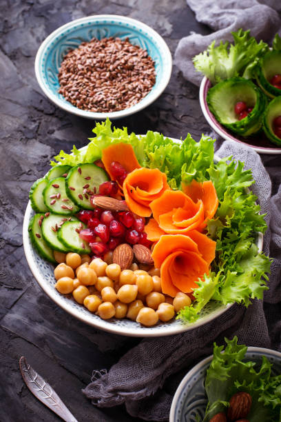 istock Vegetable salad with carrot, cucumber, pepper, almond and chick-pea 652806314