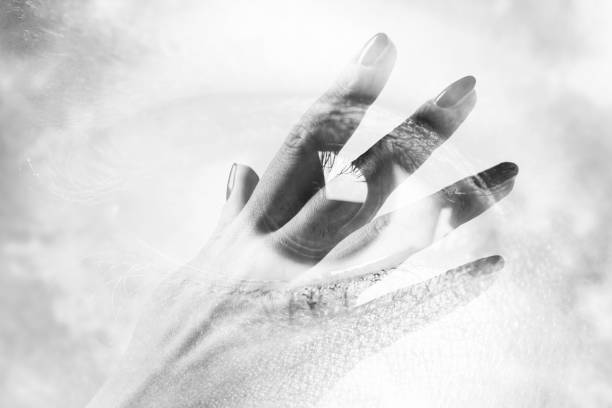 istock Double exposure of an eye with hand 652812596