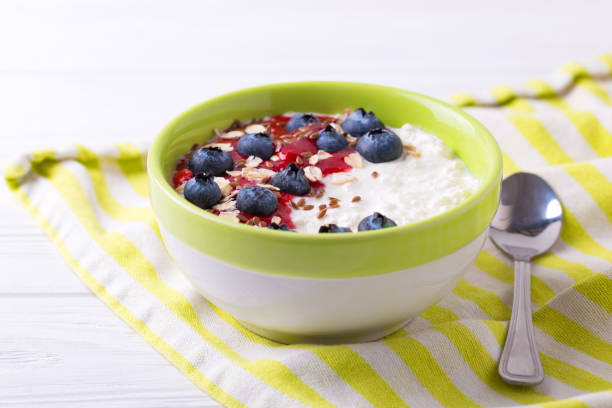 istock Oatmeal with blueberries, raspberry jam, flax seeds and yogurt 652816236