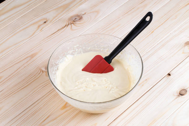 istock Dough in a glass bowl on a wooden table 652822316