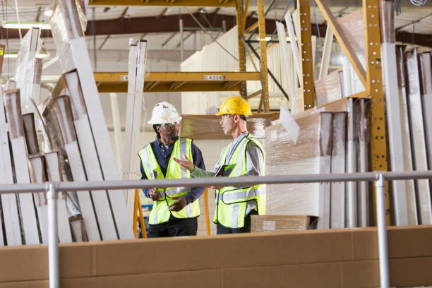 istock Two men in a warehouse of construction supplies talking 652836182