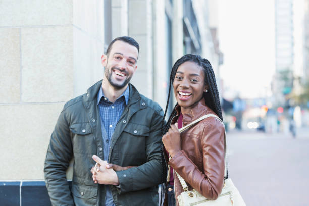 istock Young interracial couple walking in city 652836820