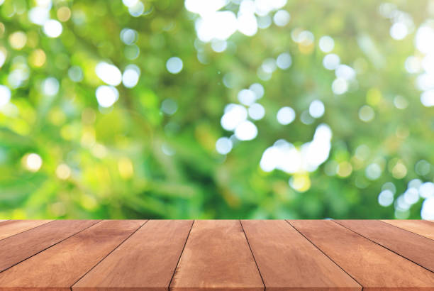 istock Abstract spring or summer with sunlight background and wood table 652839600