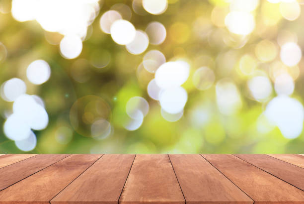 istock Abstract spring or summer with sunlight background and wood table 652839602
