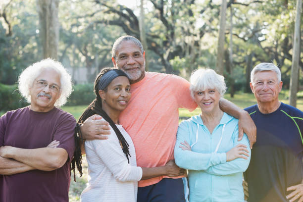 istock Group of five multi-ethnic seniors standing in park 652842600