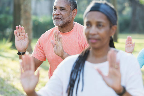 istock African American man taking tai chi class in park 652842618