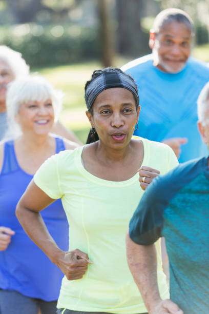 istock Multi-ethnic group of seniors running in park 652842732