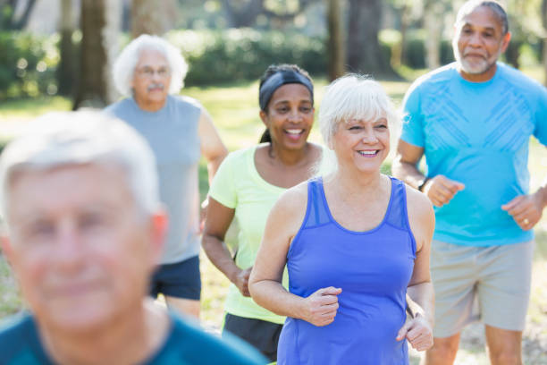 istock Multi-ethnic group of seniors running in park 652842744