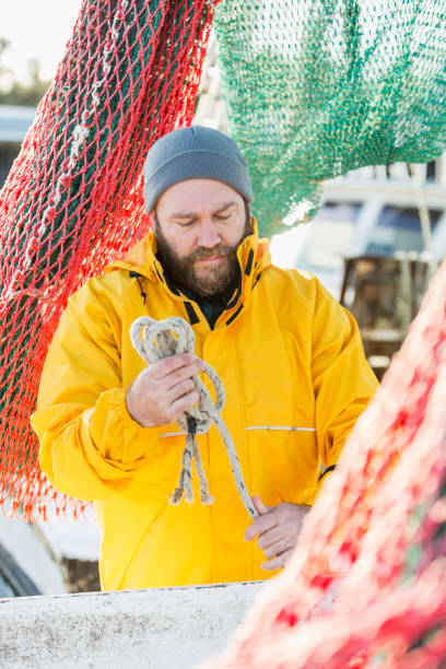 istock Man working on commercial fishing vessel 652843314