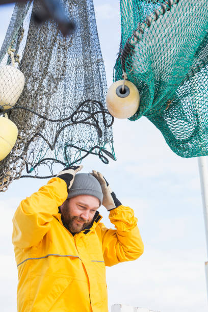 istock Man working on commercial shrimp boat 652843618