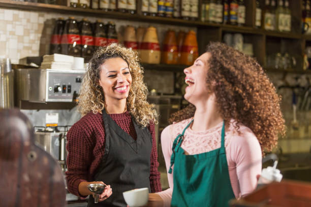 istock Two young women working in coffee shop 652844078