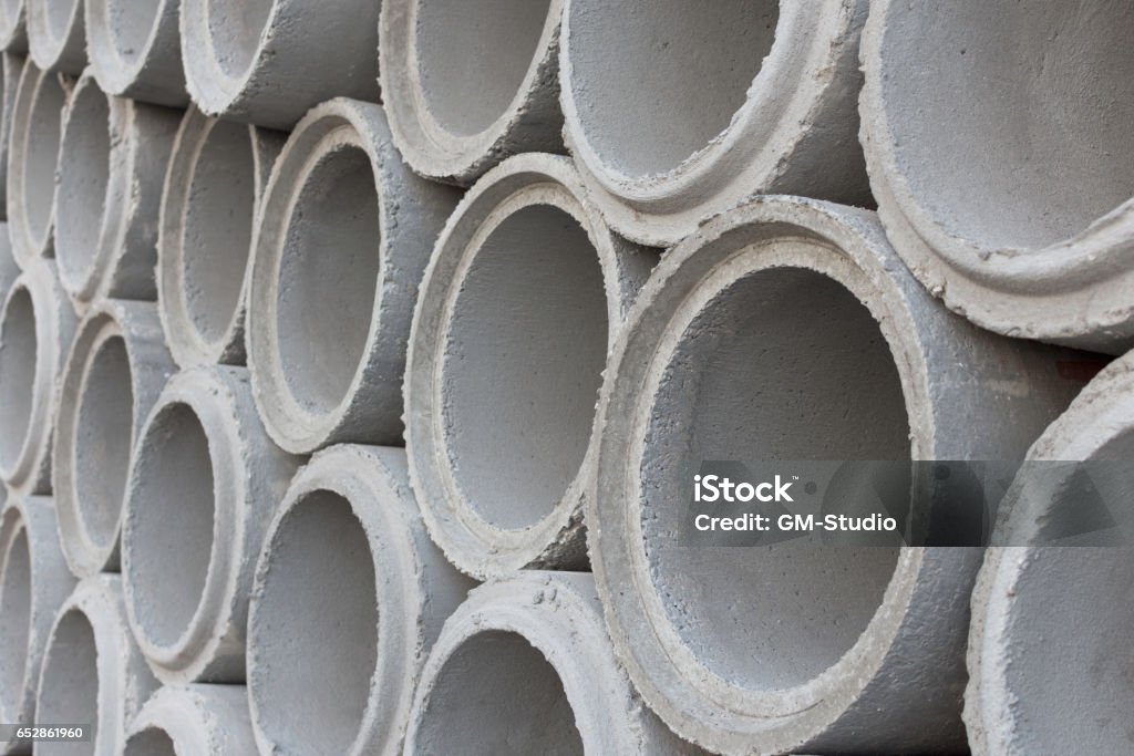 Cement pipes for construction water system. Adult Stock Photo
