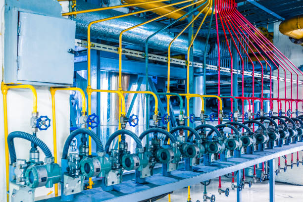 istock steel pipelines and cables in a plant 652882270